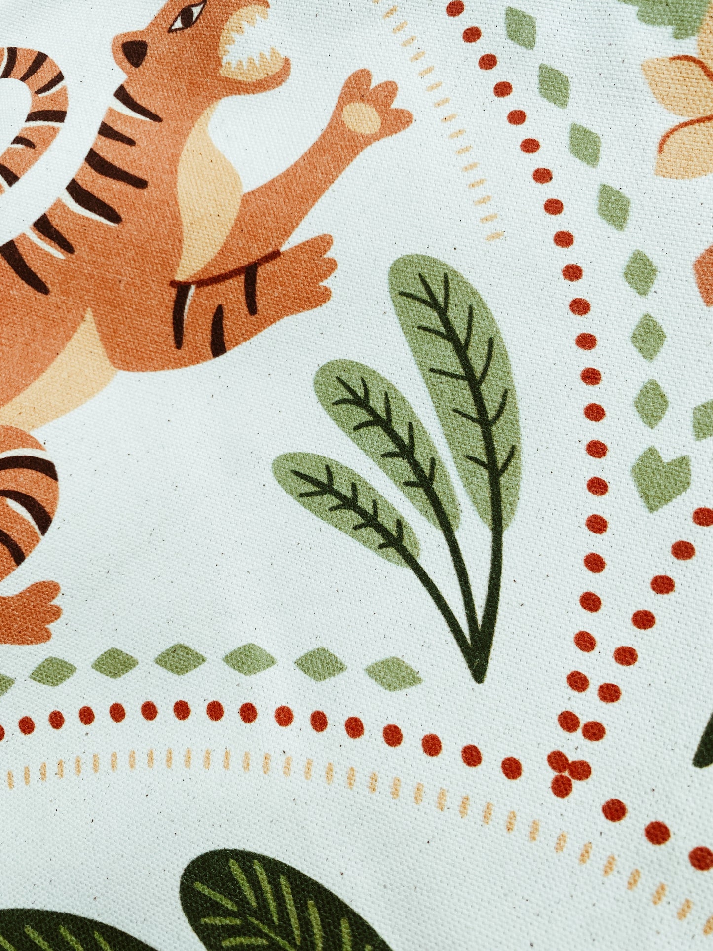 Illustration of a tiger with floral elements on a patterned background