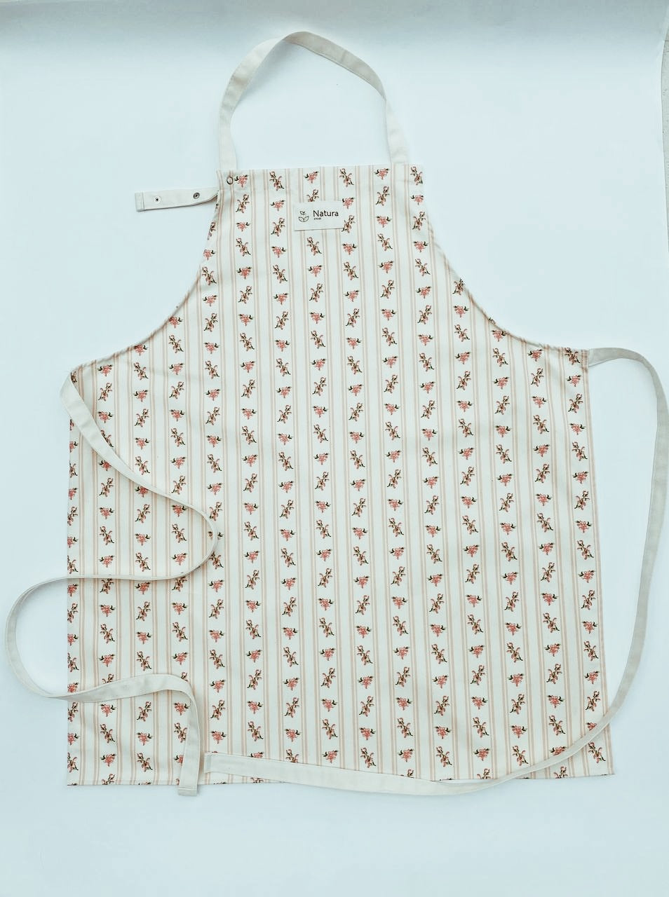 Patterned  French Farmhouse apron on a light blue background