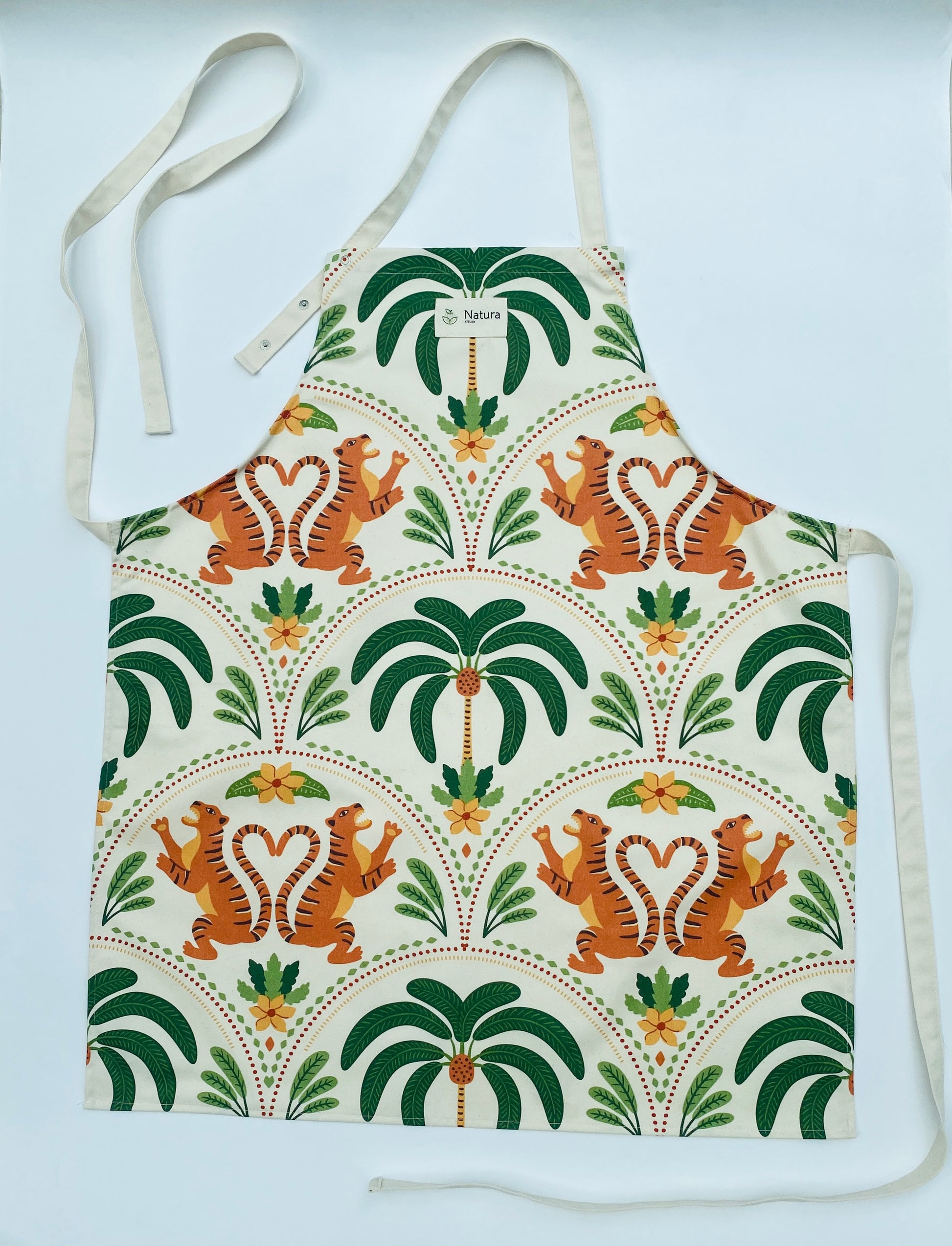 Apron with tiger and palm tree pattern on a white background