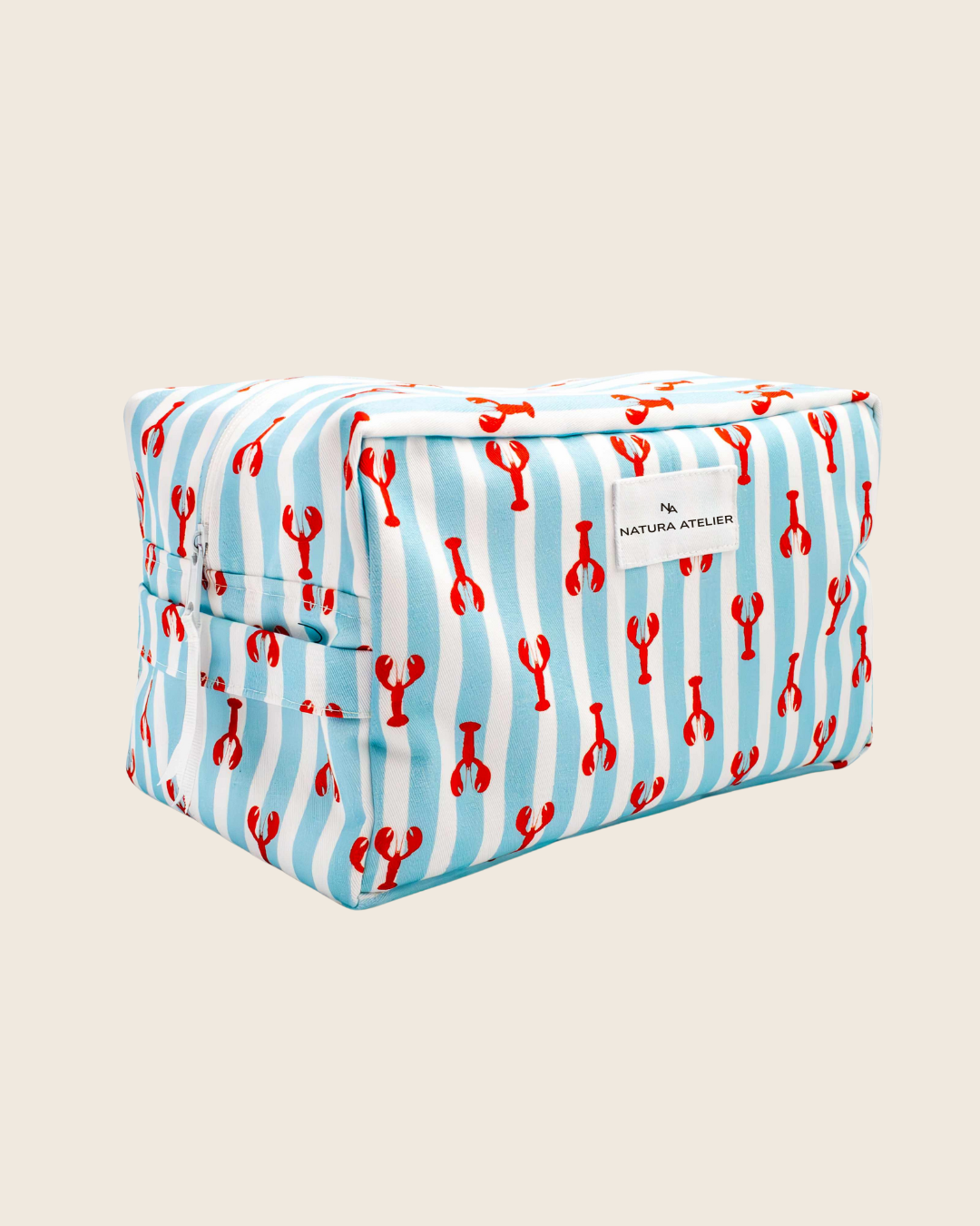 Rectangular pouch with red lobster pattern on a blue background, branded 'Natura Atelier'.