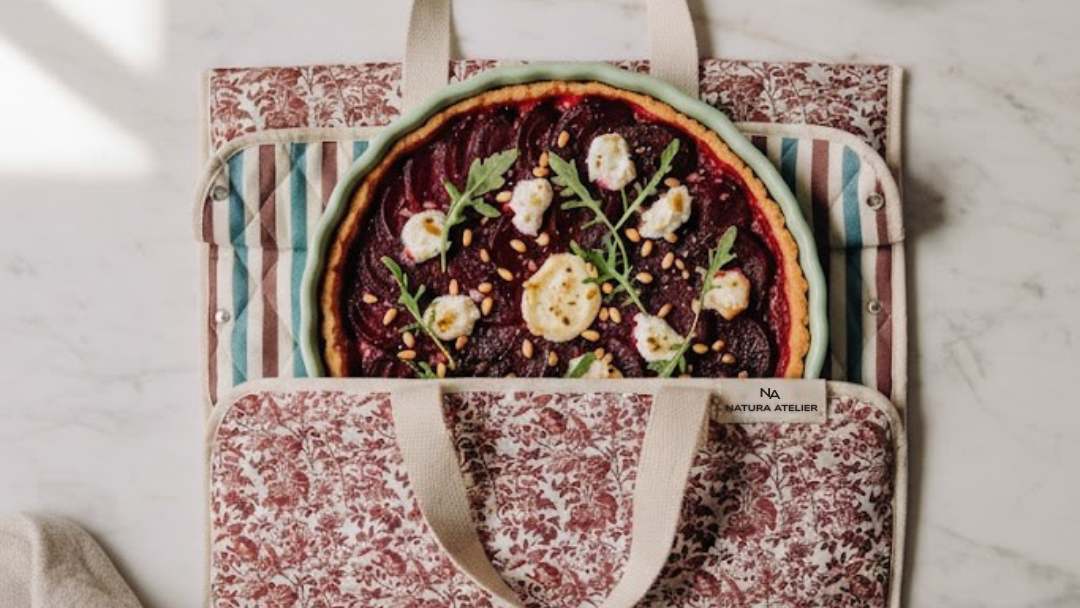 Beetroot tart in Toile De Jouy pattern quiche carrier bag. 